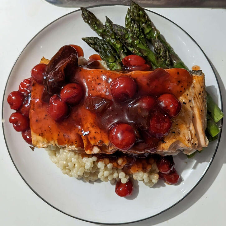 cherry chipotle salmon with white pearl couscous and roasted asparagus