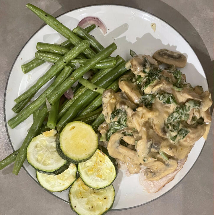 mushroom gravy on baked chicken with veggies