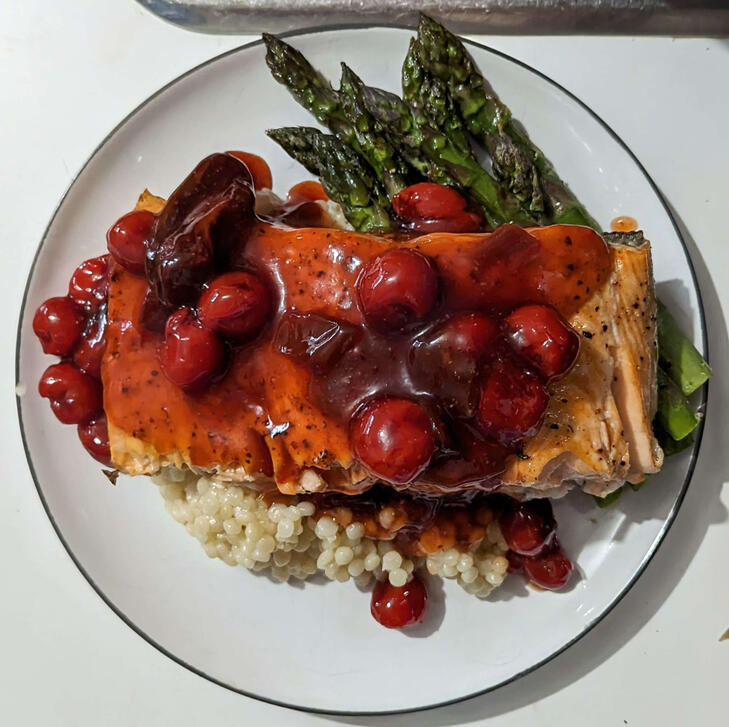 cherry chipotle salmon with asparagus and cous cous