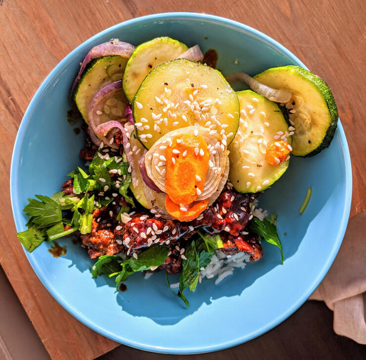 cripsy teriyaki chicken and rice with zucchini and greens