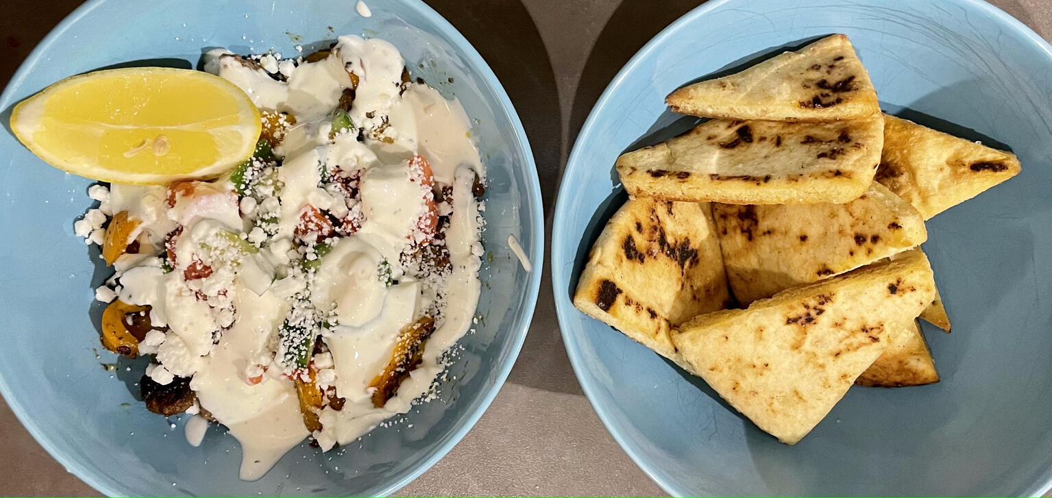 moroccan spiced beef with roasted peppers, spiced mayo frizzle and feta, baked pita until crispy with oil and salt to dip